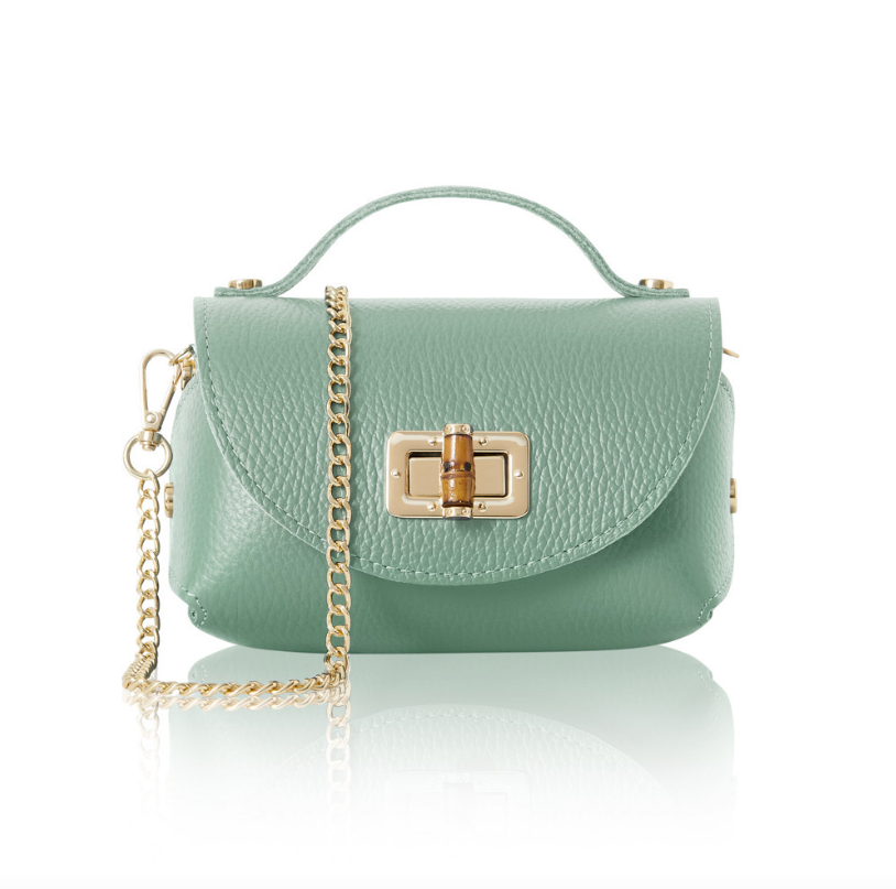 A small, structured dusty green leather handbag with a textured finish, featuring a gold turn-lock closure on the front flap, a short top handle, and a detachable gold chain shoulder strap. 