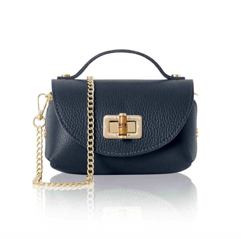 A small, structured Navy leather handbag with a textured finish, featuring a gold turn-lock closure on the front flap, a short top handle, and a detachable gold chain shoulder strap. 