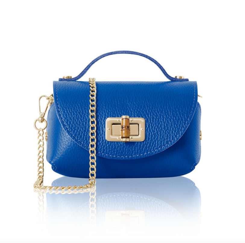 A small, structured Royal Blue leather handbag with a textured finish, featuring a gold turn-lock closure on the front flap, a short top handle, and a detachable gold chain shoulder strap. 