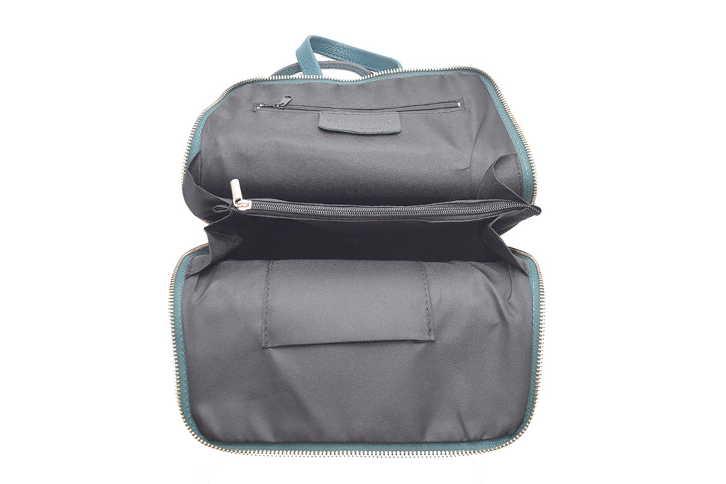 Teal 3 in 1 grainy leather backpack and cross body daypack with three external zip compartments, two are front facing with one on the back, and one internal zip pocket. This backpack can be turned into a cross body bag or handbag, the straps are adjustable
