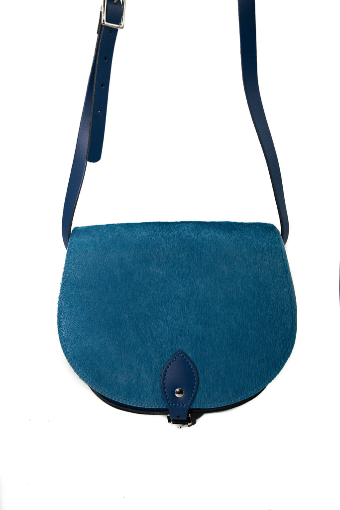 Teal Blue cowhide hair Leather handmade saddle cross body handbag with adjustable belt buckle shoulder strap, made in London. Visit out customise section to choose your own colours and have a bespoke custom saddle bag made for you. A to Z Leather LTD
