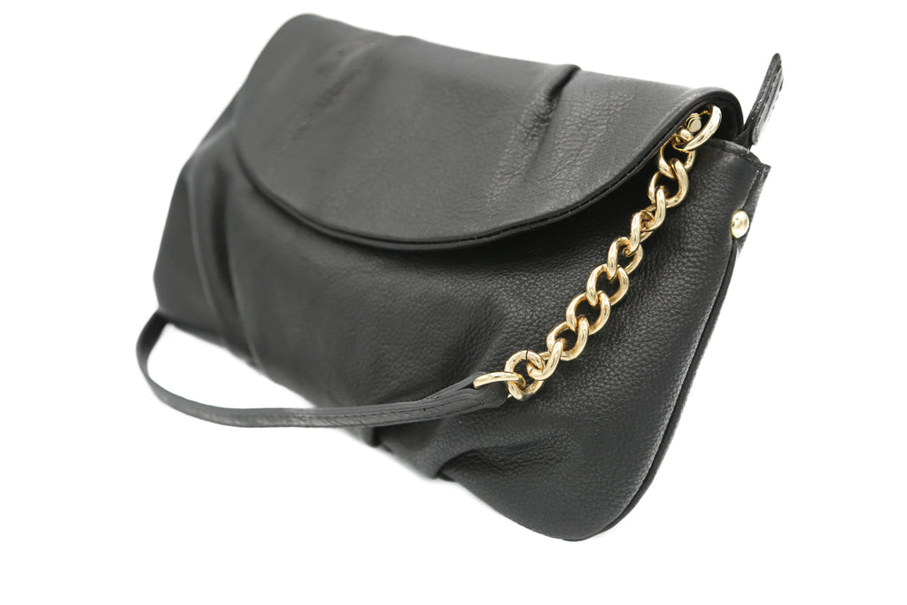 Black Leather Cross body clutch - a Sophisticated supple day or evening clutch handbags.  These clutch handbags are soft to hold and stylish with a leather and chain adjustable strap.  A great addition for a light travel bag which can be used both day or evening time.  An internal compartment and detachable strap.