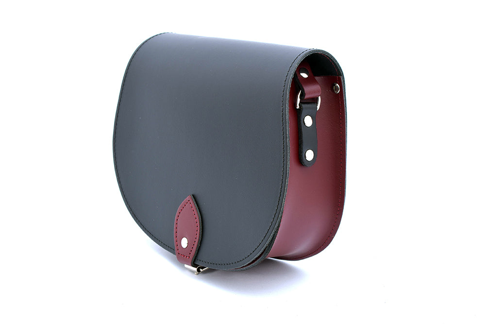 Black and Burgundy Leather handmade saddle cross body handbag with adjustable belt buckle shoulder strap, made in London. Visit out customise section to choose your own colours and have a bespoke custom saddle bag made for you. A to Z Leather LTD