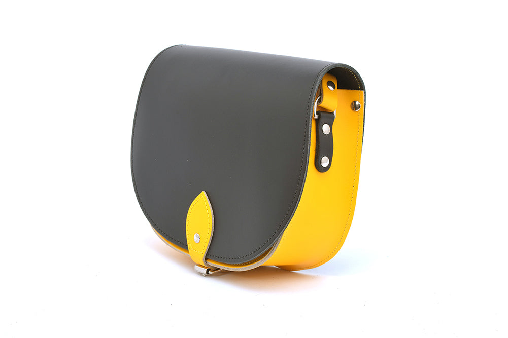 Black and Yellow Leather handmade saddle cross body handbag with adjustable belt buckle shoulder strap, made in London. Visit out customise section to choose your own colours and have a bespoke custom saddle bag made for you. A to Z Leather LTD