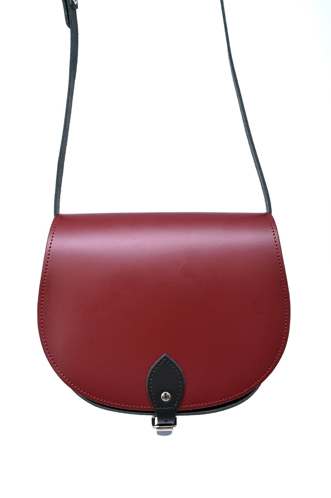 Burgundy and Black Leather handmade saddle cross body handbag with adjustable belt buckle shoulder strap, made in London. Visit out customise section to choose your own colours and have a bespoke custom saddle bag made for you. A to Z Leather LTD