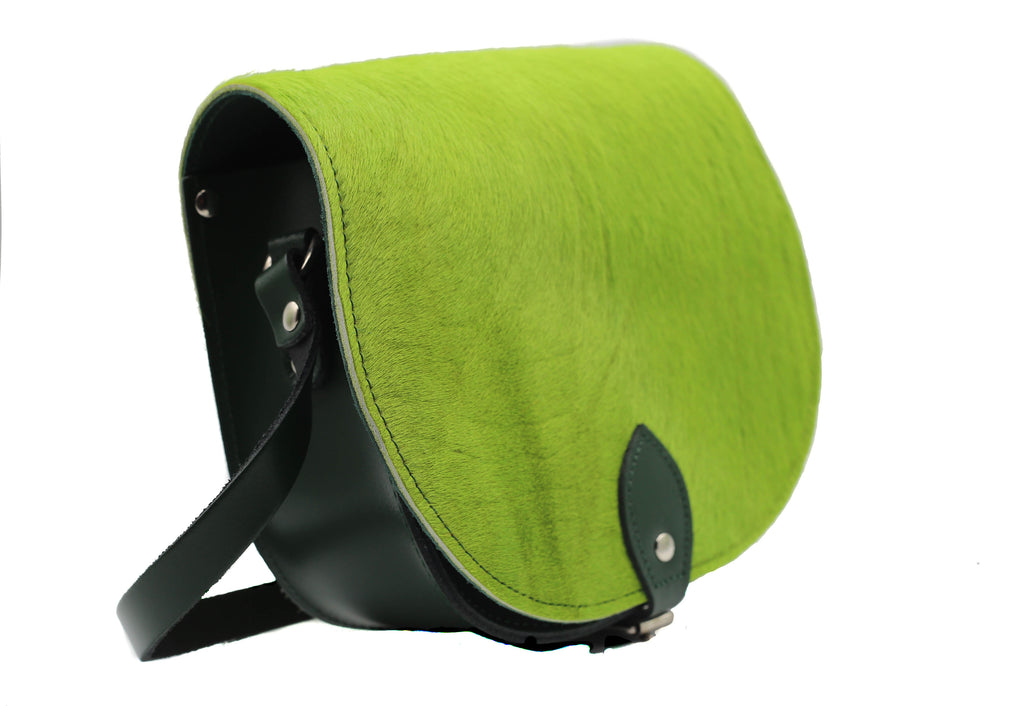 Green Patterned Cowhide Hair and Black Leather handmade saddle cross body handbag with adjustable belt buckle shoulder strap, made in London. Visit out customise section to choose your own colours and have a bespoke custom saddle bag made for you. A to Z Leather LTD
