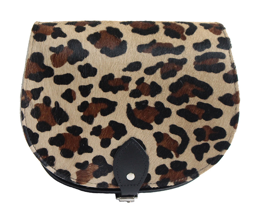 Leopard Patterned Cowhide Hair and Brown Leather handmade saddle cross body handbag with adjustable belt buckle shoulder strap, made in London. Visit out customise section to choose your own colours and have a bespoke custom saddle bag made for you. A to Z Leather LTD