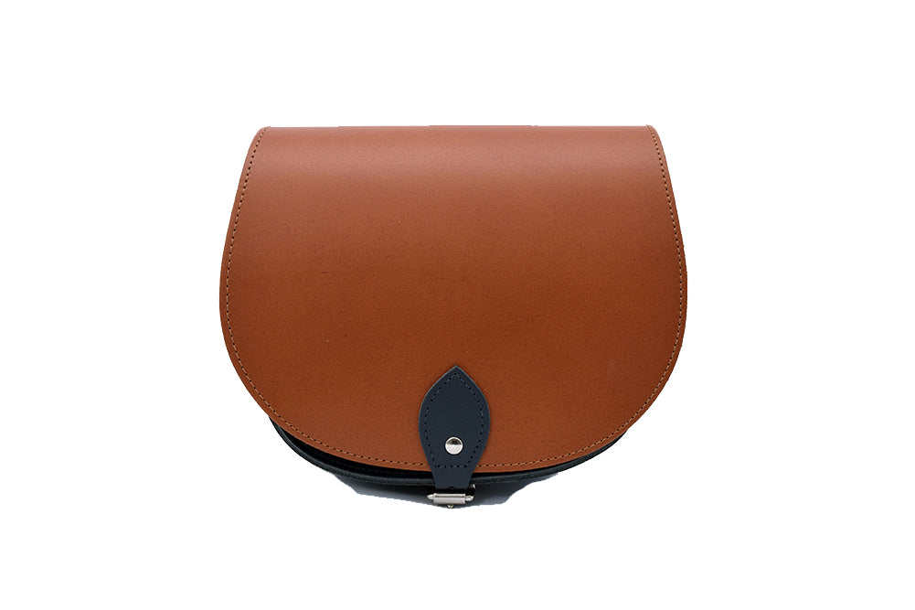 Tan and Black Leather handmade saddle cross body handbag with adjustable belt buckle shoulder strap, made in London. Visit out customise section to choose your own colours and have a bespoke custom saddle bag made for you. A to Z Leather LTD