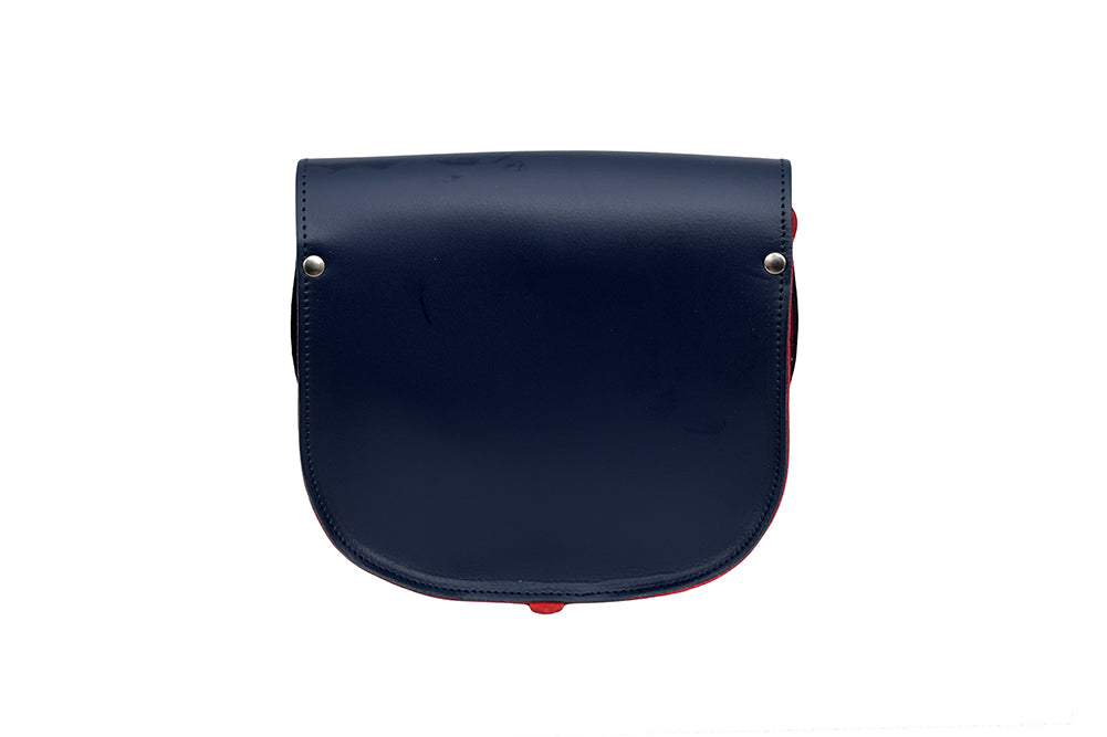 Navy and Red Leather handmade saddle cross body handbag with adjustable belt buckle shoulder strap, made in London. Visit out customise section to choose your own colours and have a bespoke custom saddle bag made for you. A to Z Leather LTD