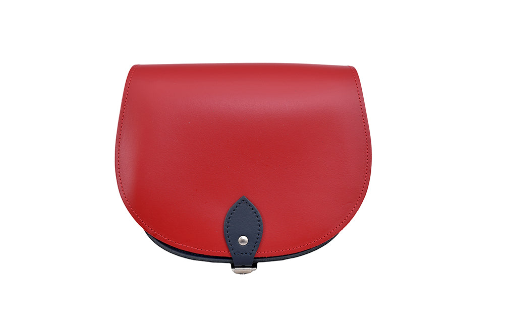 red and navy Leather handmade saddle cross body handbag with adjustable belt buckle shoulder strap, made in London. Visit out customise section to choose your own colours and have a bespoke custom saddle bag made for you. A to Z Leather LTD