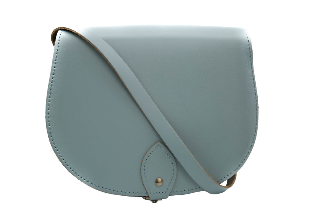 Baby blue Leather handmade saddle cross body handbag with adjustable belt buckle shoulder strap, made in London. Visit out customise section to choose your own colours and have a bespoke custom saddle bag made for you. A to Z Leather LTD