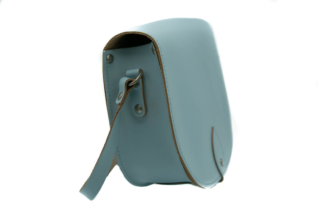 Baby blue Leather handmade saddle cross body handbag with adjustable belt buckle shoulder strap, made in London. Visit out customise section to choose your own colours and have a bespoke custom saddle bag made for you. A to Z Leather LTD