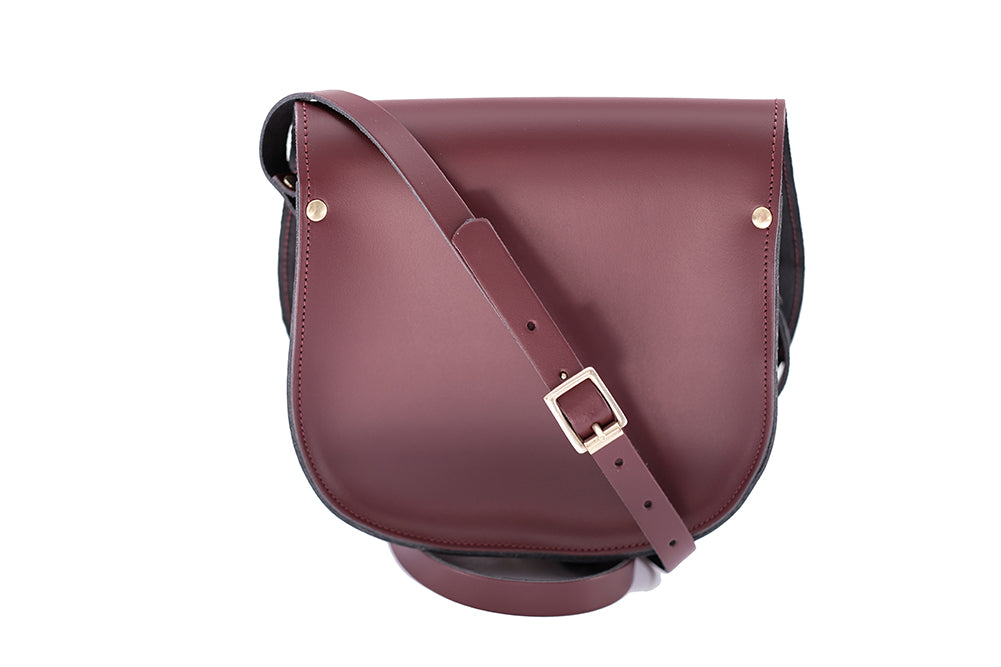 burgundy Leather handmade saddle cross body handbag with adjustable belt buckle shoulder strap, made in London. Visit out customise section to choose your own colours and have a bespoke custom saddle bag made for you. A to Z Leather LTD