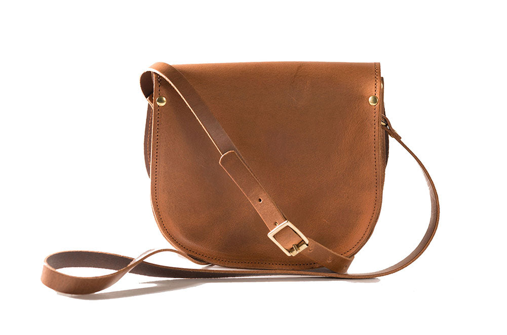 vintage tan Leather handmade saddle cross body handbag with adjustable belt buckle shoulder strap, made in London. Visit out customise section to choose your own colours and have a bespoke custom saddle bag made for you. A to Z Leather LTD