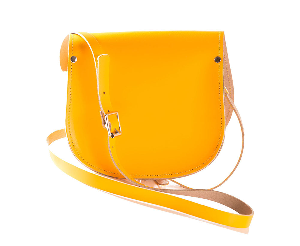 Yellow Leather handmade saddle cross body handbag with adjustable belt buckle shoulder strap, made in London. Visit out customise section to choose your own colours and have a bespoke custom saddle bag made for you. A to Z Leather LTD